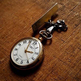 Old Fashioned dark gold pocket watch.