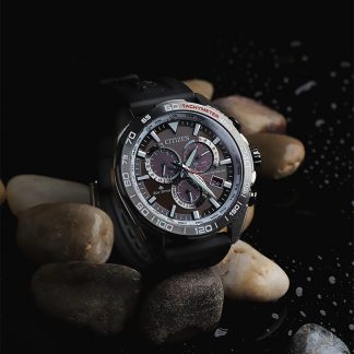 Traditional Citizen Watch over wet pebbles.