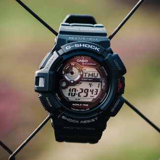 G force watch hanging on a wire fence