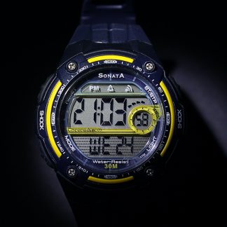 Black with yellow trim digital watch above black background.